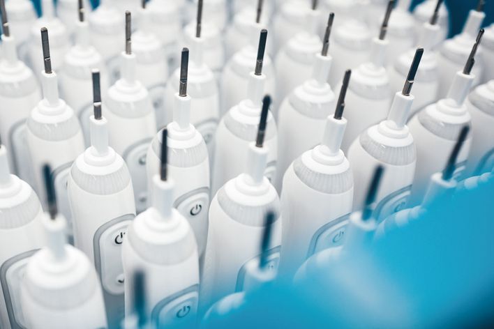 High volume production of toothbrushes