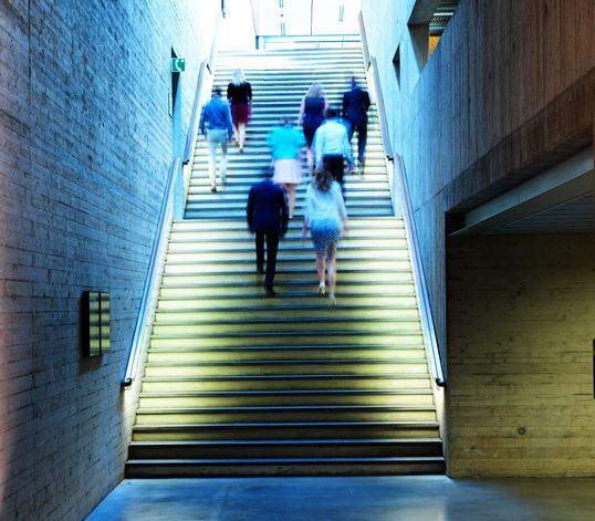 TRUMPF employees walking upstairs