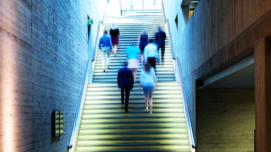 TRUMPF employees walking up-stairs