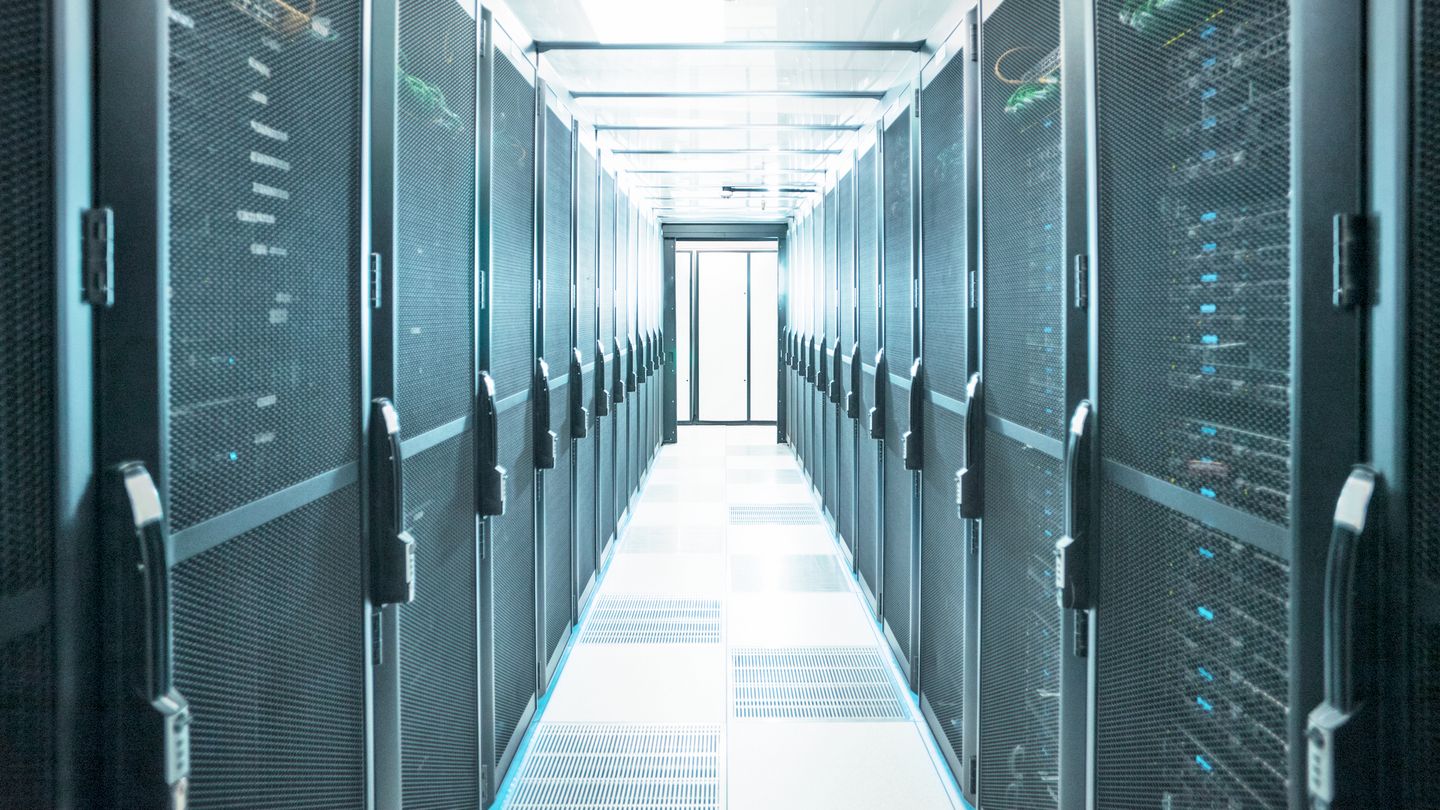 Mainframe computers in centre of data center server farm.