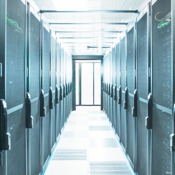 Mainframe computers in centre of data center server farm.