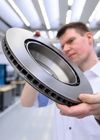 TRUMPF employee with coated brake disc.